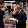 British Prime Minister David Cameron and Mayor Michael Bloomberg have a hotdog outside of Penn Station